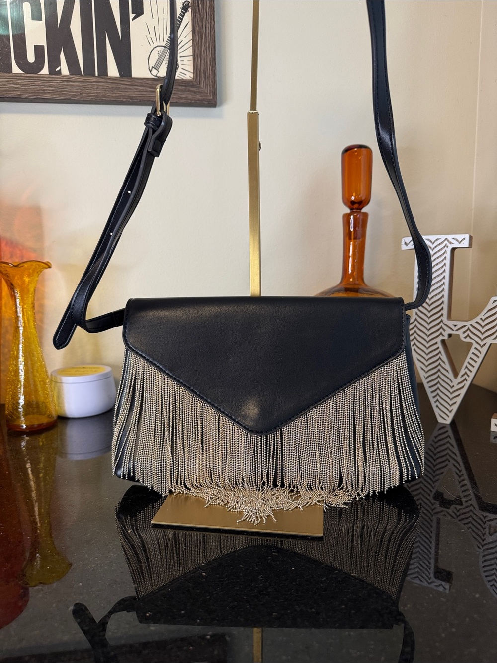 Express Black Crossbody Bag with Gold Fringe Chain